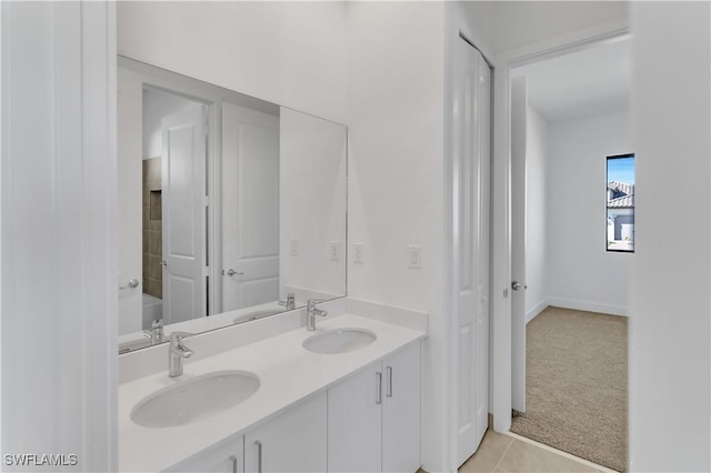 bathroom with tile patterned floors and vanity