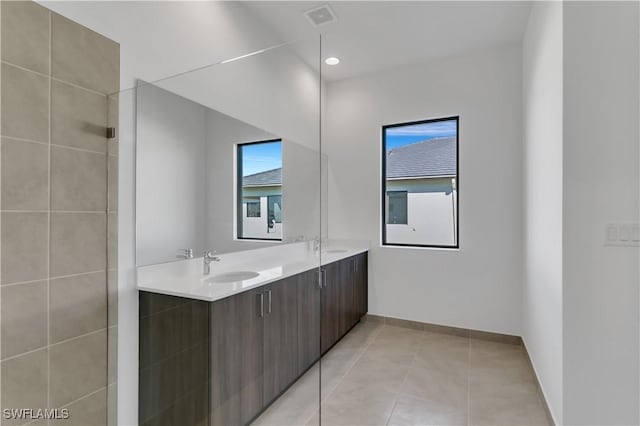 bathroom with tile patterned floors and vanity