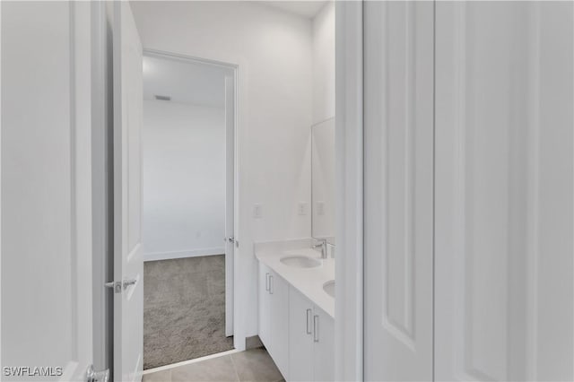 bathroom with tile patterned flooring and vanity