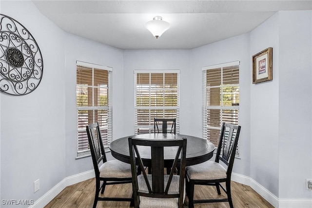 dining area featuring hardwood / wood-style flooring