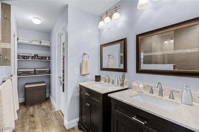 bathroom with vanity and hardwood / wood-style flooring