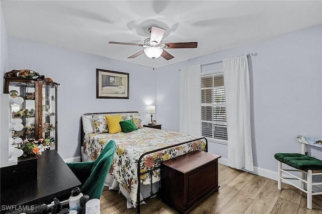 bedroom featuring ceiling fan and light wood-type flooring