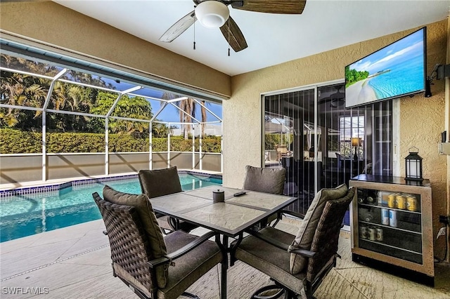 view of patio / terrace featuring ceiling fan, a lanai, and a fenced in pool