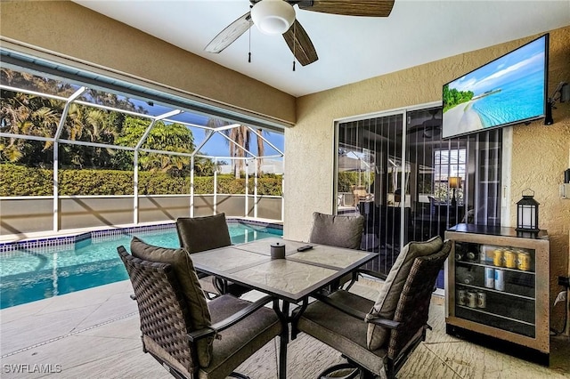 view of patio with a fenced in pool, a lanai, and ceiling fan