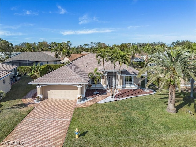 view of front of property with a garage and a front yard