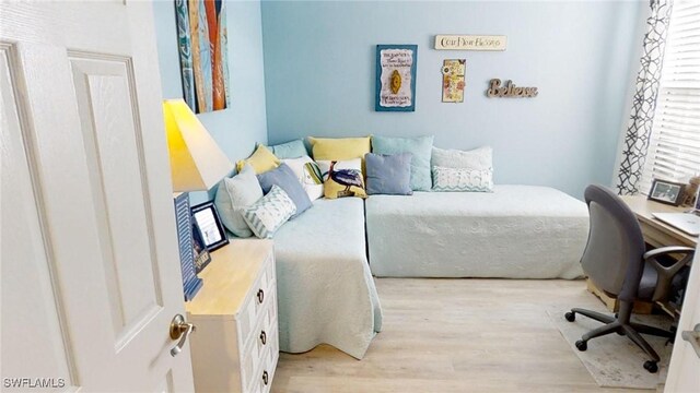 bedroom with light wood-type flooring