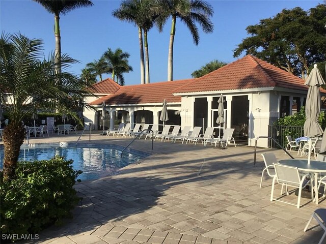 view of swimming pool featuring a patio area