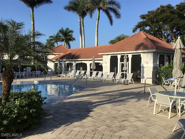 2135 Arielle Dr Unit 2407, Naples, FL 34109 - community pool featuring a patio area