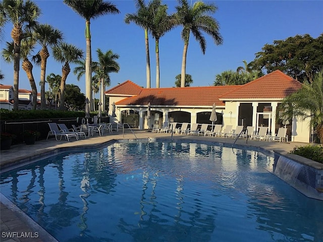 2135 Arielle Dr Unit 2407, Naples, FL 34109 - community pool with a patio area