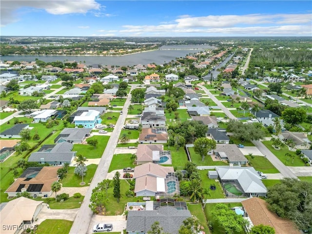 birds eye view of property with a water view