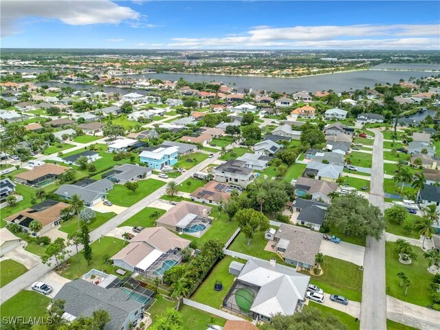 drone / aerial view with a water view