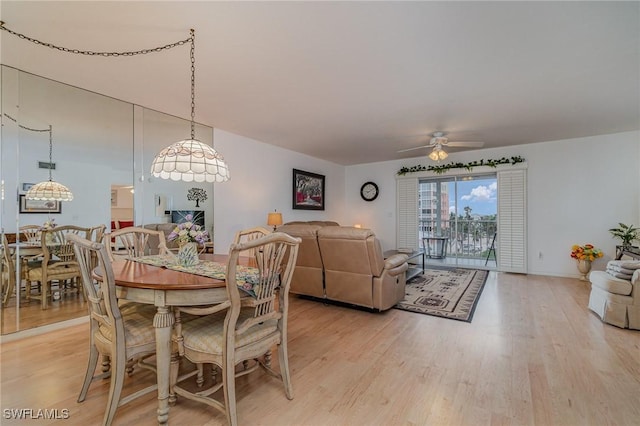 dining area featuring ceiling fan and light wood-type flooring