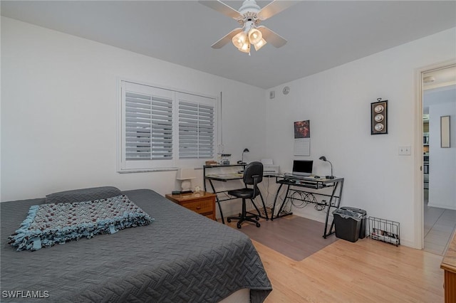 bedroom with hardwood / wood-style flooring and ceiling fan