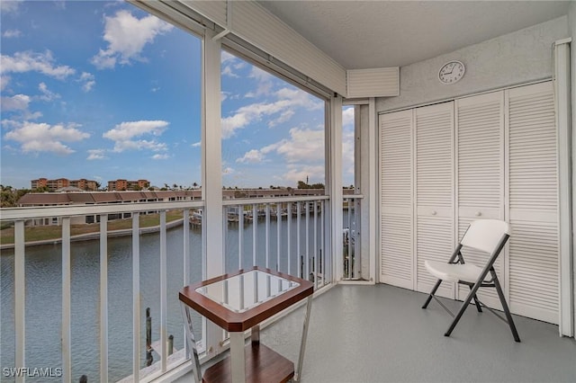 balcony featuring a water view