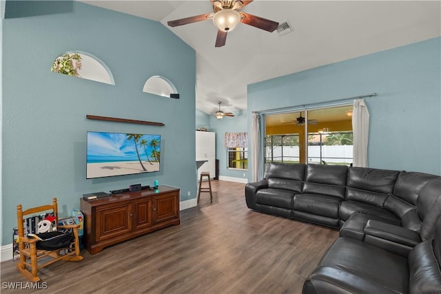 living room with lofted ceiling and dark hardwood / wood-style floors