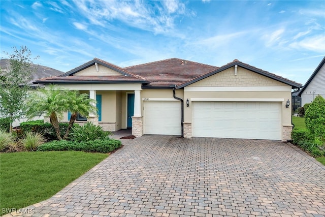 view of front facade with a front yard and a garage