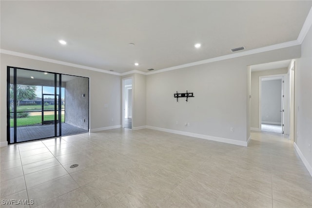 unfurnished room with crown molding