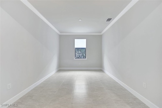 spare room featuring ornamental molding