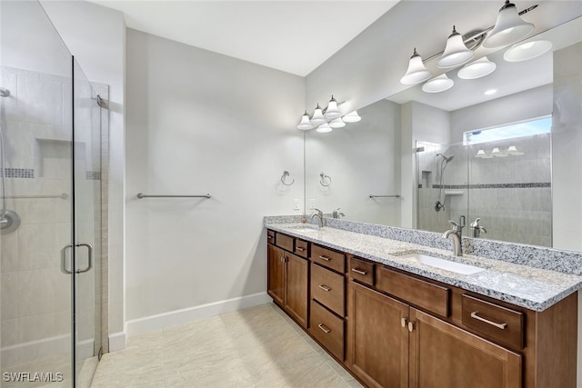 bathroom with walk in shower and vanity