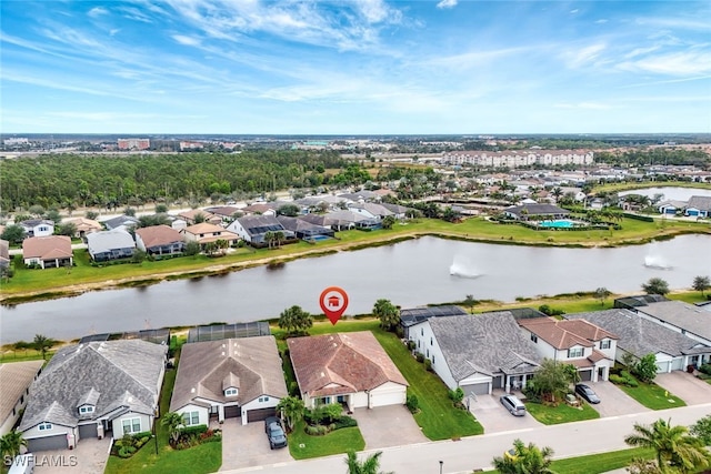 birds eye view of property featuring a water view