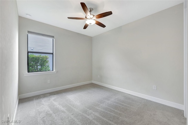 unfurnished room featuring ceiling fan and carpet flooring