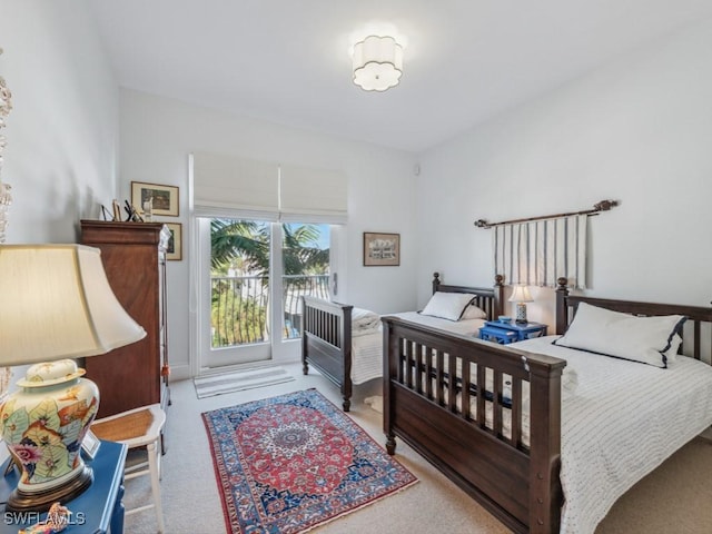 bedroom featuring light carpet