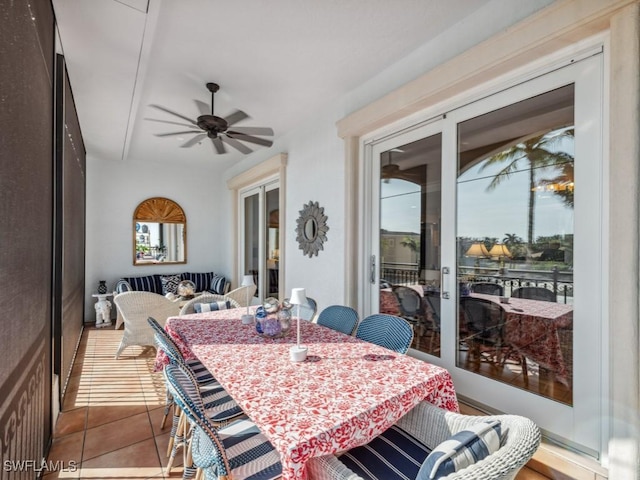 dining area with ceiling fan, a healthy amount of sunlight, and light tile patterned flooring