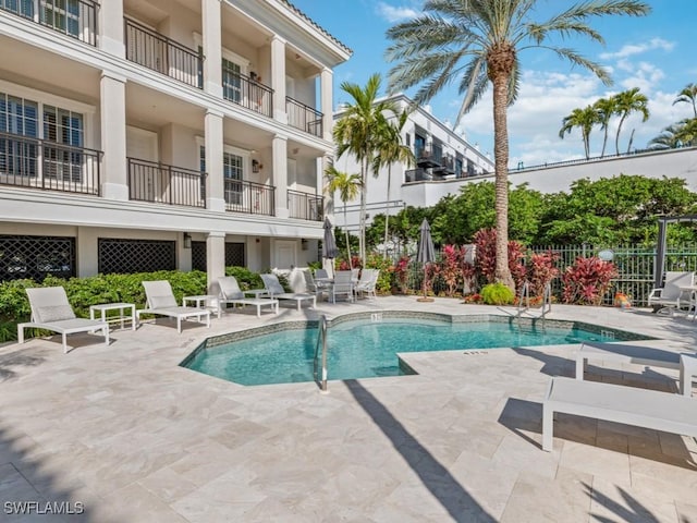 view of swimming pool with a patio