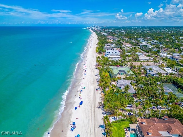 birds eye view of property featuring a view of the beach and a water view