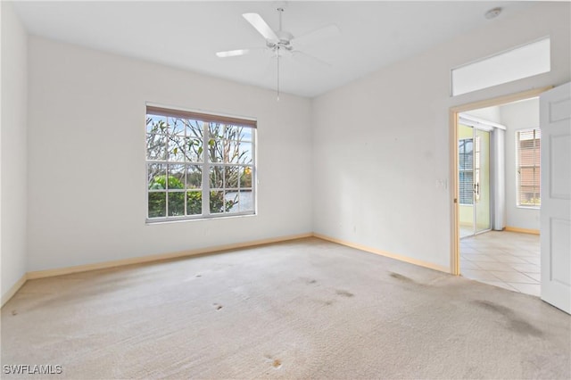 carpeted empty room with ceiling fan