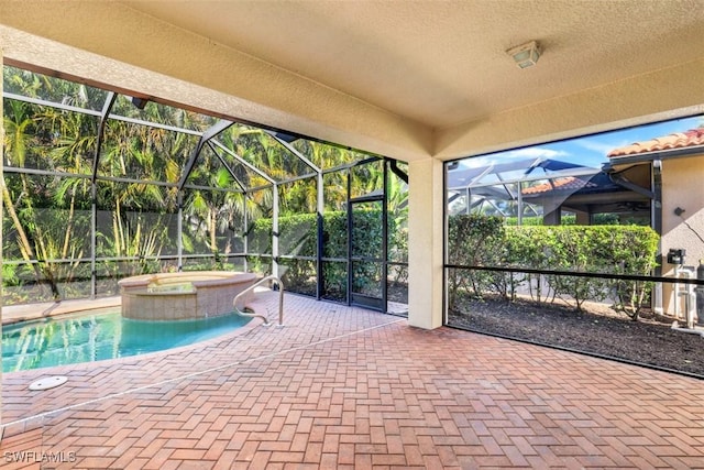 view of pool featuring an in ground hot tub, a lanai, and a patio area