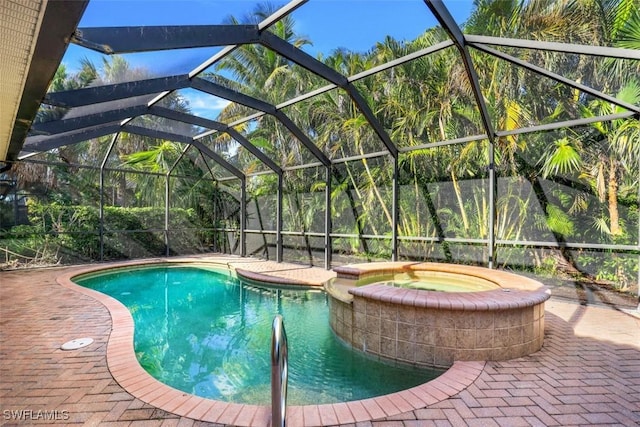 view of pool with glass enclosure, a patio area, and an in ground hot tub