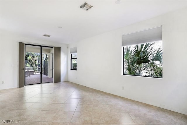 spare room with light tile patterned floors