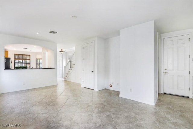 unfurnished room featuring light tile patterned floors