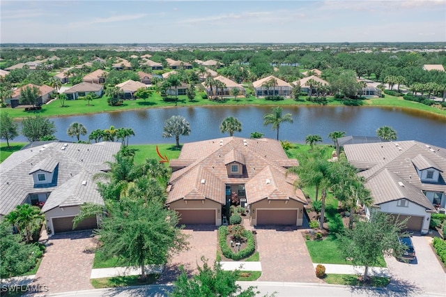 birds eye view of property featuring a water view