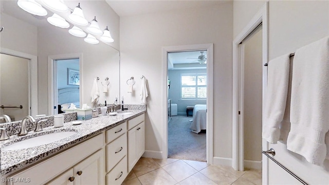 bathroom with tile patterned floors, ceiling fan, and vanity