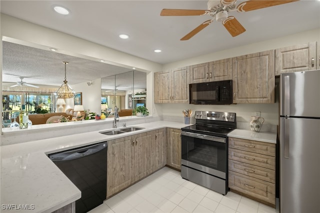 kitchen featuring black appliances, sink, hanging light fixtures, ceiling fan, and a textured ceiling