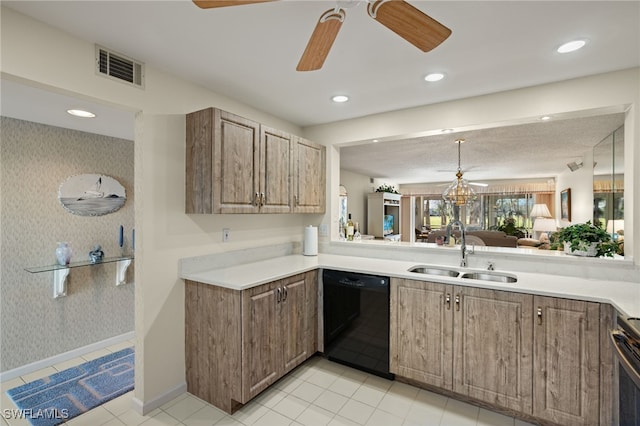 kitchen featuring dishwasher, stove, ceiling fan with notable chandelier, sink, and light tile patterned floors