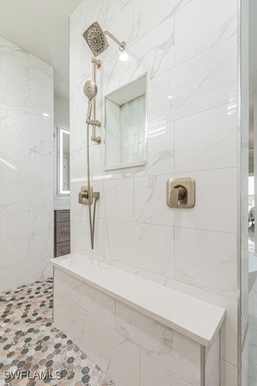 bathroom featuring a tile shower