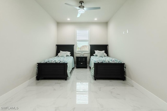 bedroom with recessed lighting, marble finish floor, and baseboards