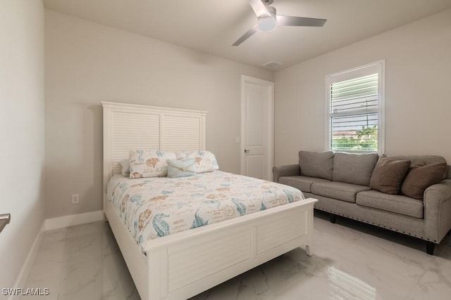 bedroom featuring marble finish floor, ceiling fan, and baseboards