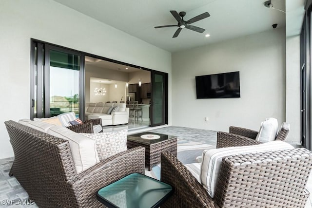 view of patio featuring ceiling fan and an outdoor living space