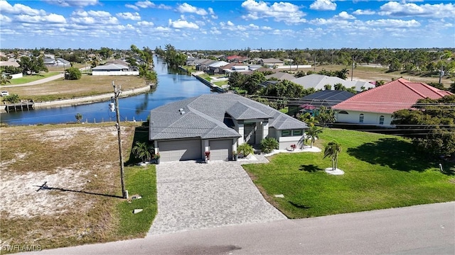 aerial view featuring a residential view and a water view