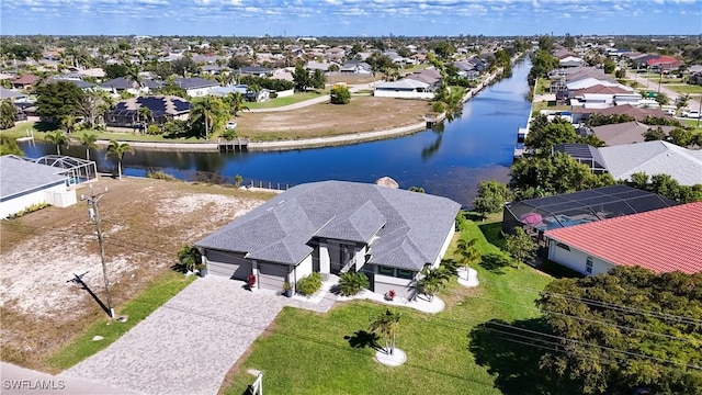 aerial view featuring a water view and a residential view