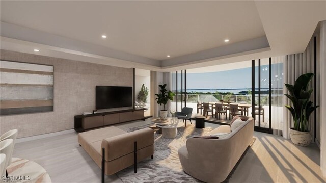 living area with wallpapered walls, a raised ceiling, wood finished floors, floor to ceiling windows, and recessed lighting