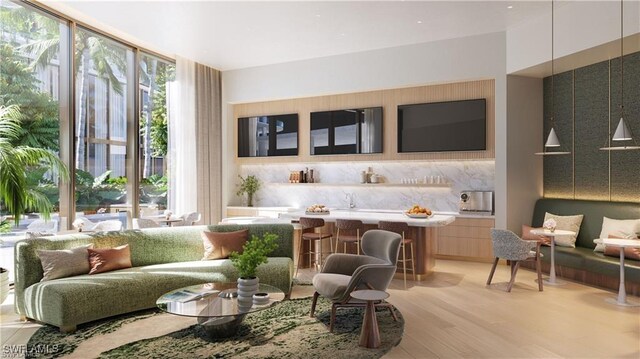 living area with light wood finished floors and a wall of windows