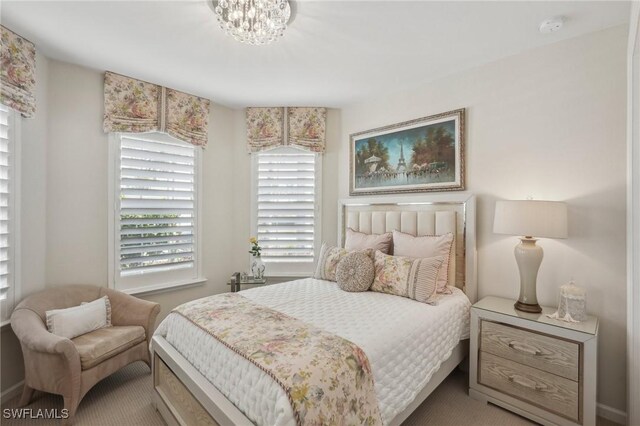 bedroom featuring a chandelier