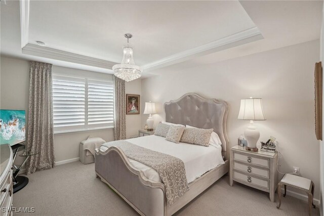 carpeted bedroom with a notable chandelier, crown molding, and a raised ceiling