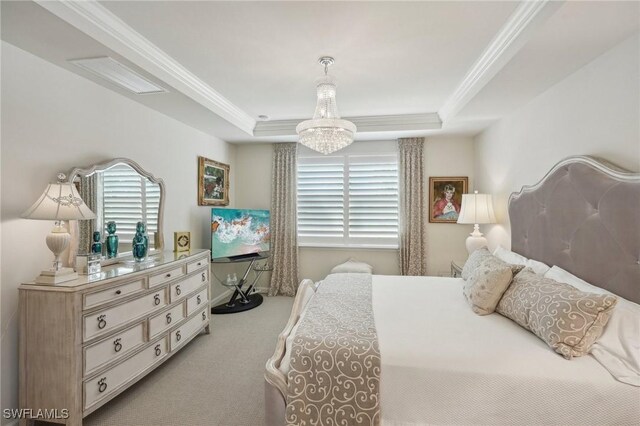 carpeted bedroom featuring a raised ceiling, ornamental molding, and a notable chandelier