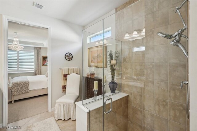 bathroom featuring plenty of natural light, an enclosed shower, and tile patterned floors